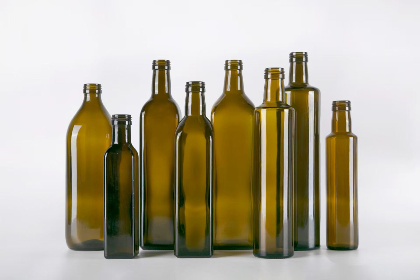 Molten glass formed into bottles on the production line