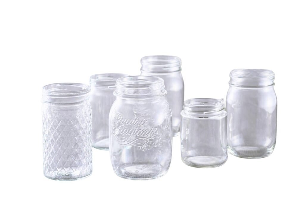 Row of glass jars with metal twist-off lids